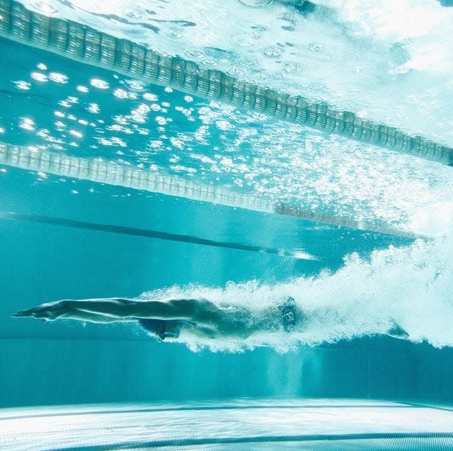 Swimmer underwater after the jump