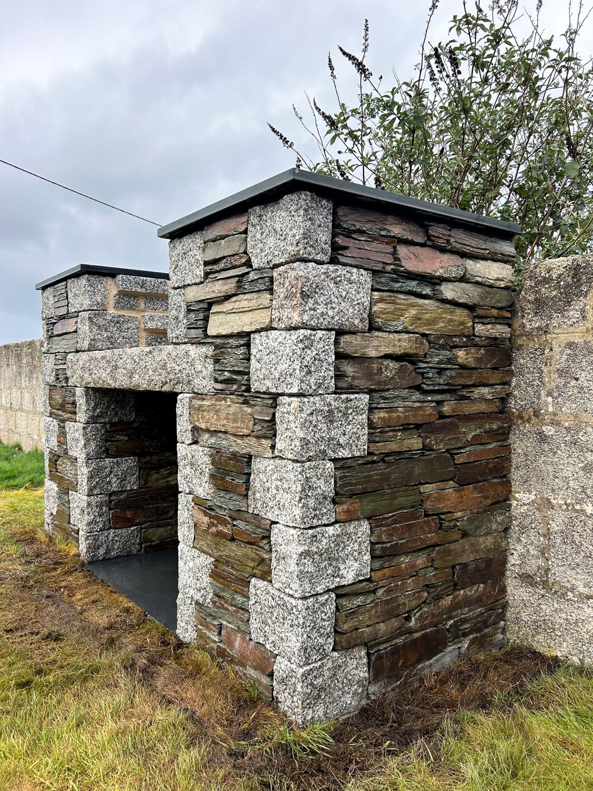 The stonemason creates a range of walls and Cornish hedges 