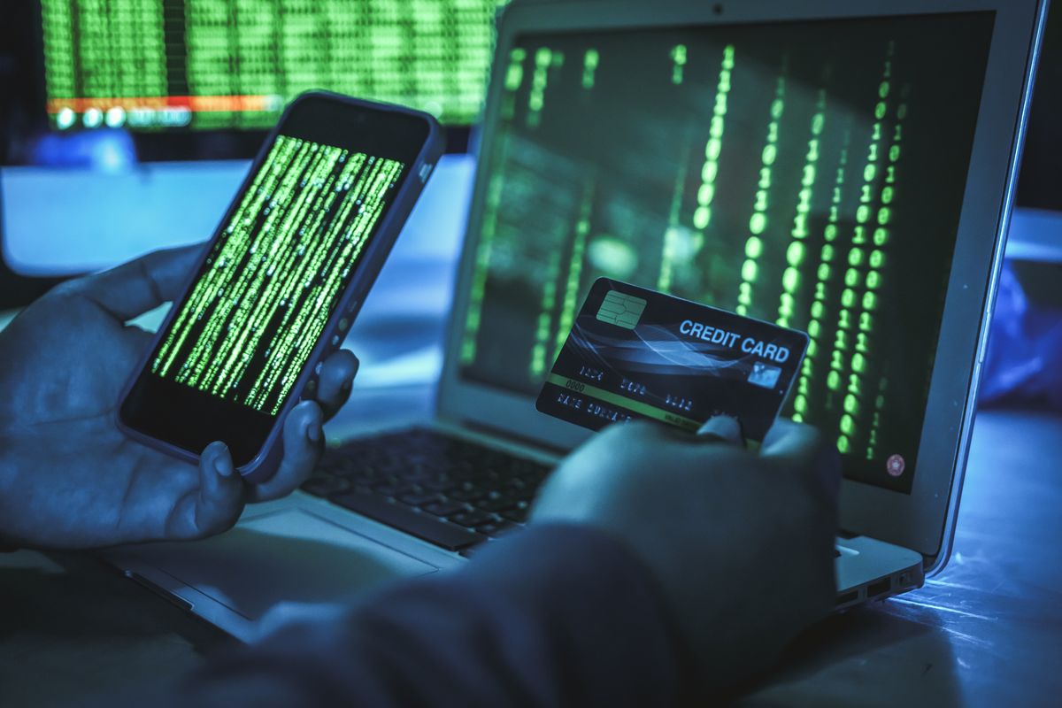 Hacker using a stolen credit card to hack someone's data