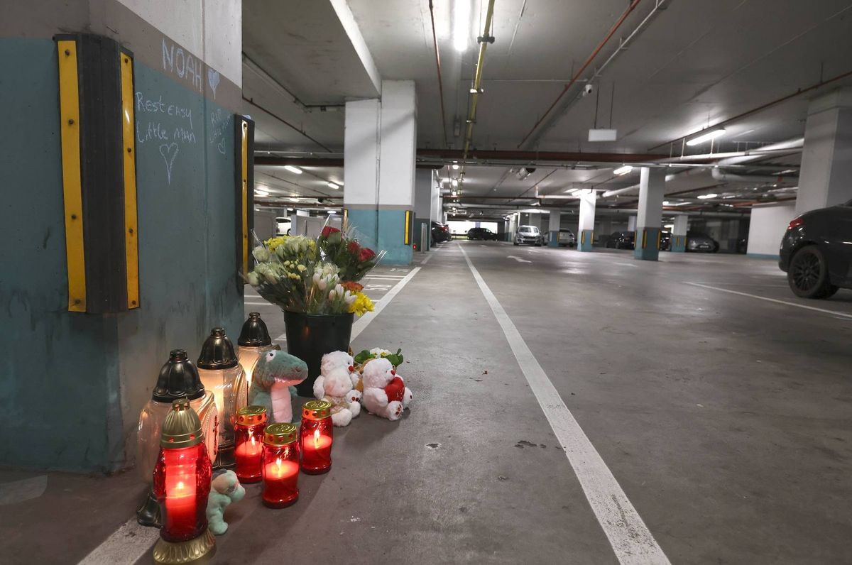 Floral tributes, candles and lanterns in the underground car park of Charlestown Shopping Centre