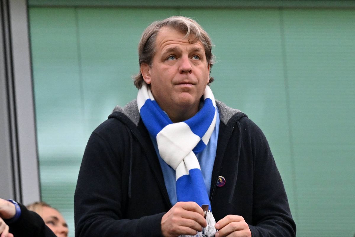 Chelsea's US owner Todd Boehly looks on wearing a scarf
