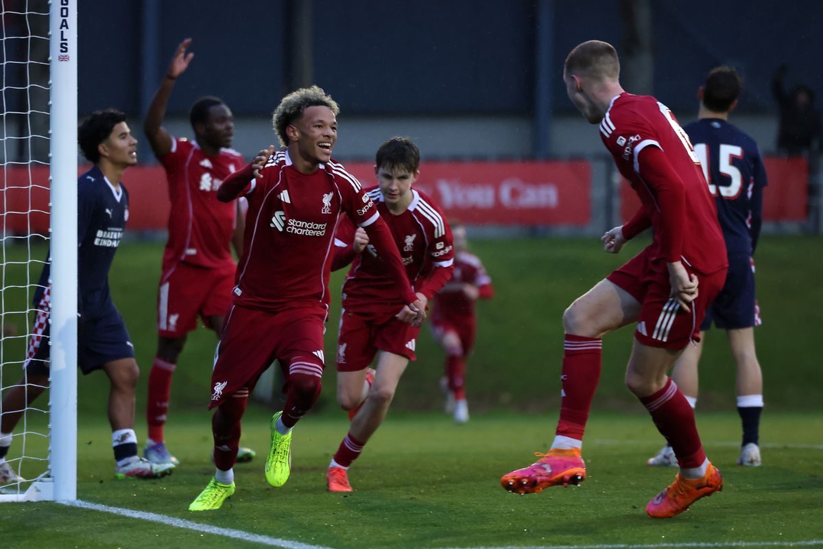 Trent Kone-Doherty of Liverpool celebrates scoring the winner with team-mate Carter Pinnington during the UEFA Youth League match against PSV Eindhoven on November 26 2025 in Kirkby