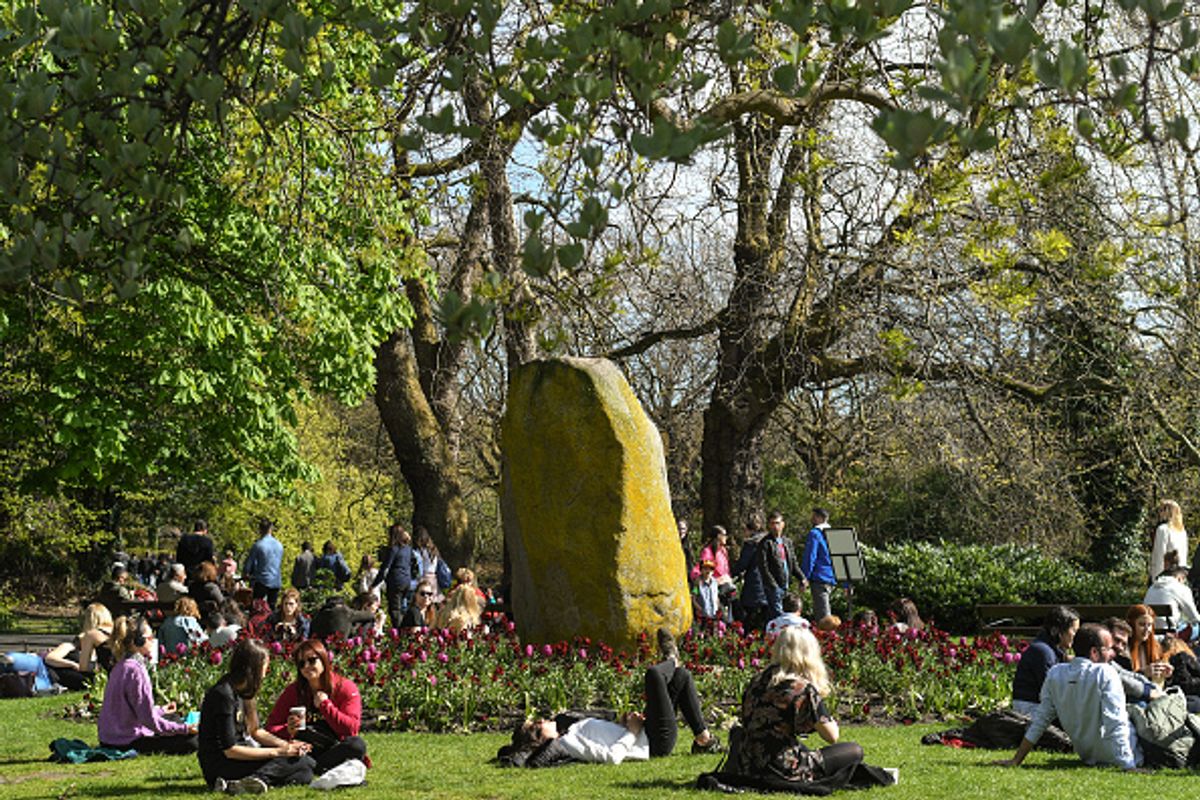 People enjoy a nice sunny weather inside St Stephen's Green Park in Dublin city center
