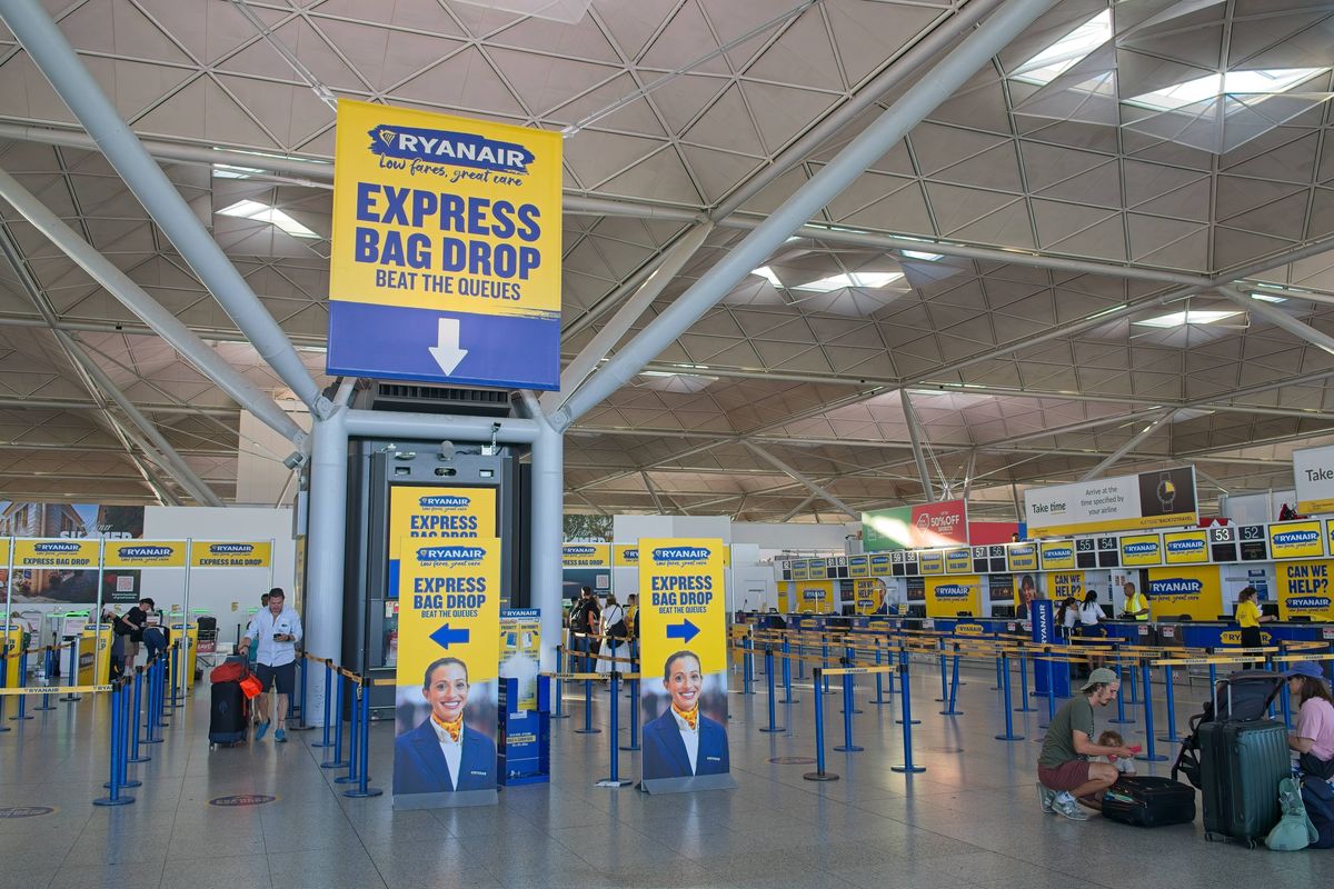 Ryanair passengers checking in at airport