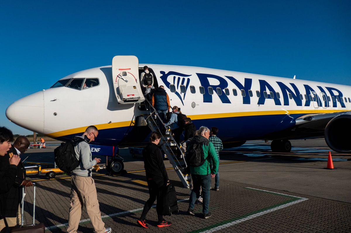 Passengers waiting in line and boarding a Ryanair low cost airline airplane at London Stansted Airport in the UK. The Boeing 737-800 passenger aircraft of the budget carrier has the registration tail number EI-ENF. Ryanair is an Irish Ultra Low-cost carrier group with headquarters in Dublin, Ireland with a fleet of 607 planes. Stansted Airport is the tertiary international airport serving London, the capital of England and the United Kingdom, fourth busiest in the UK owned by Manchester Airports Group. Stansted, United Kingdom on October 11, 2024 (Photo by Nicolas Economou/NurPhoto via Getty Images)