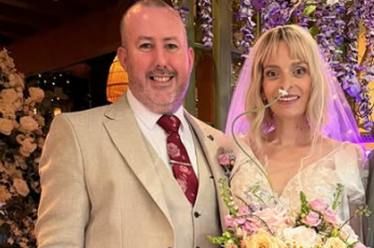 Liz and her husband Kieran on their wedding day