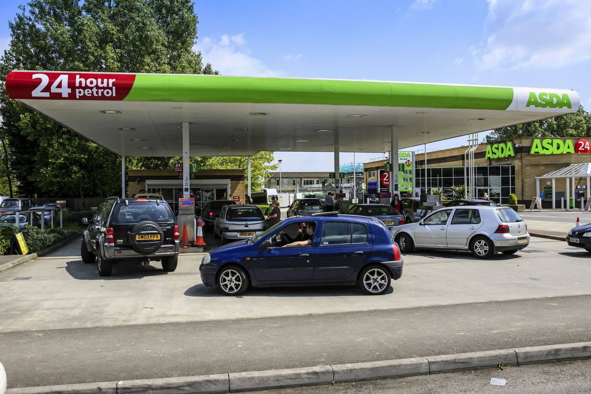 Vehicles waiting to fill up their vehicles at a gasoline filling station in Yeovil, Somerset UK