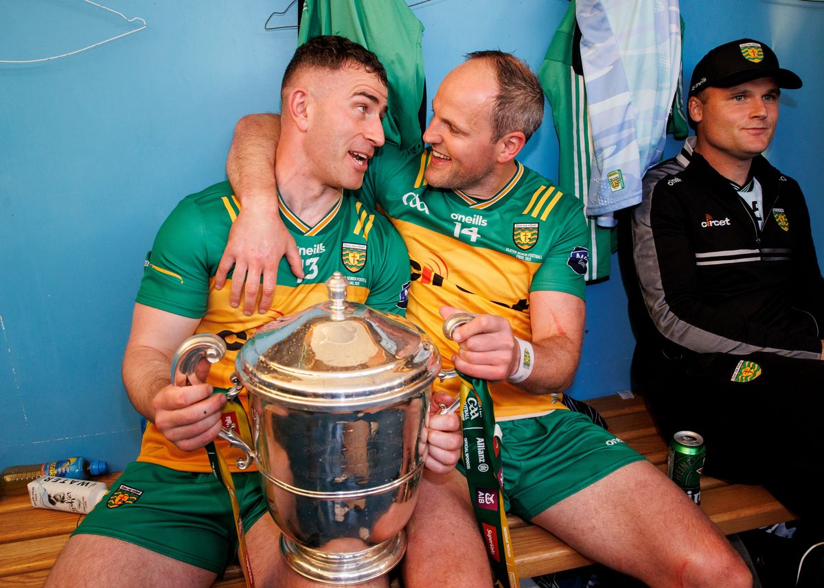 Donegal's Paddy McBrearty and Michael Murphy celebrate in the dressing room with the Ulster GAA Senior trophy