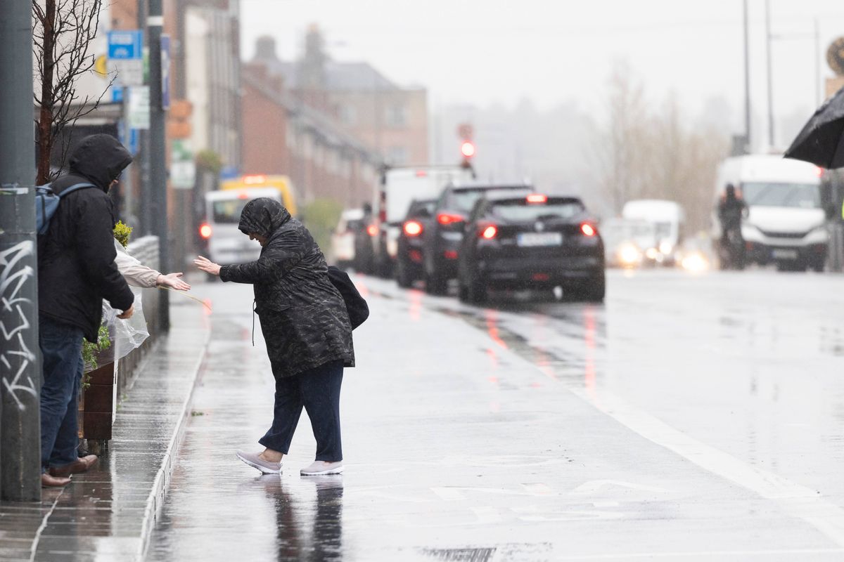 File photo of people contending with heavy rain and puddles in Dublin 