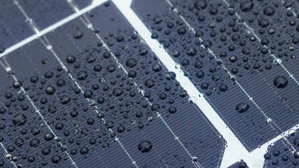 Solar panels with water droplets on their surface. renewable energy
