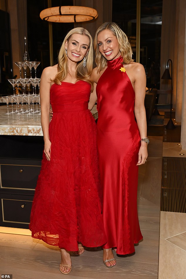 The classical singer, 45, looked incredible in a red dress as she posed for photos with celebrity guests at The Chancery Rosewood in London