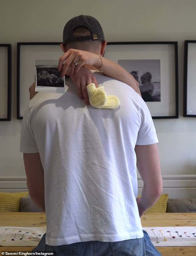 Taking to Instagram, Sammi and Callum were seen hugging as she draped a pair of knitted baby socks and a sonogram over his shoulders