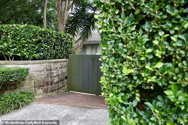 Tradesmen were seen arriving at the Vaucluse property Sandilands shares with wife Tegan, 40, and son Otto, three, to clean the gutters only to be sent away due to the media frenzy