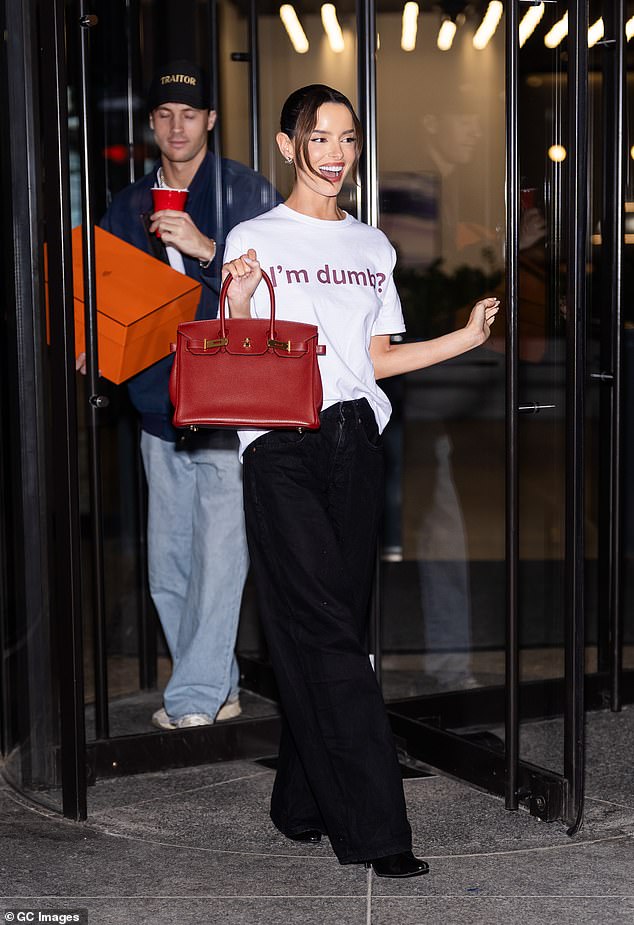 Maura showed off her new eye catching luxury handbag as she posed up a storm for photos outside the studio