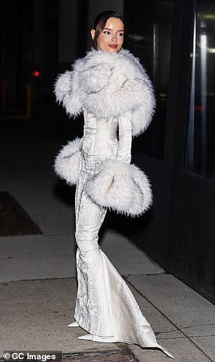 Maura elevated her frame in a pair of white heels and accessorised with dazzling earrings