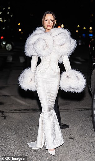 Styling her brunette tresses in a neat up do, Maura elevated her frame in a pair of white heels and accessorised with dazzling earrings