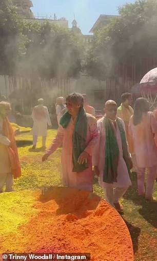 They were also seen throwing orange, yellow and red powder into the air