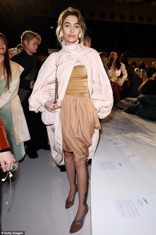 Paris Jackson wore a palette of earthy tones with a puffball skirt and cape coat