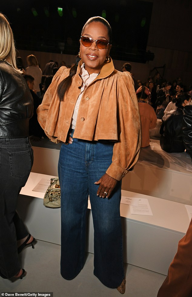 Oprah looked absolutely incredible wearing a tan suede cropped coat and jeans