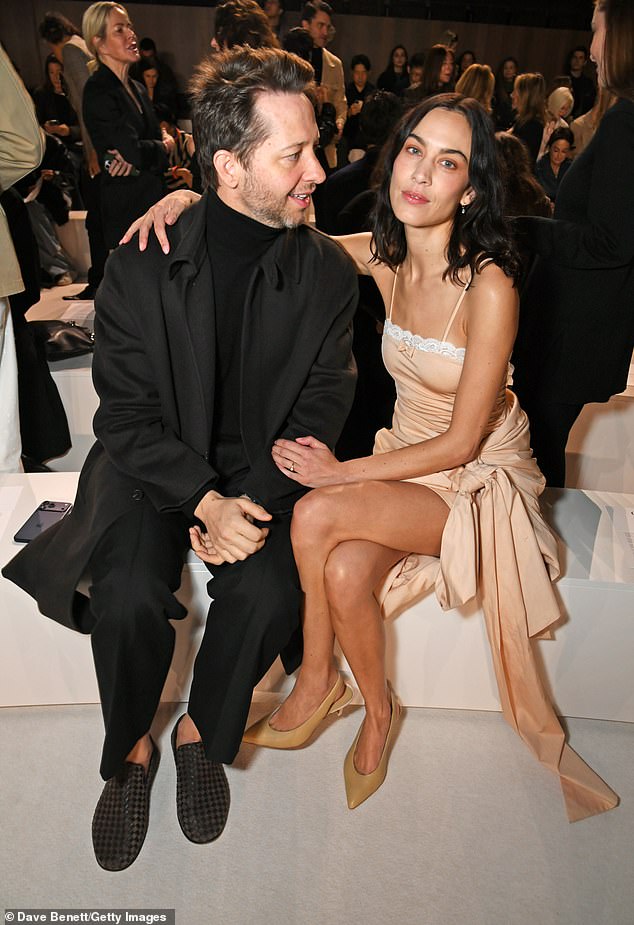 She sat alongside designer Derek Blasberg and stood out from the crowd wearing red eye make-up which made her eyes pop