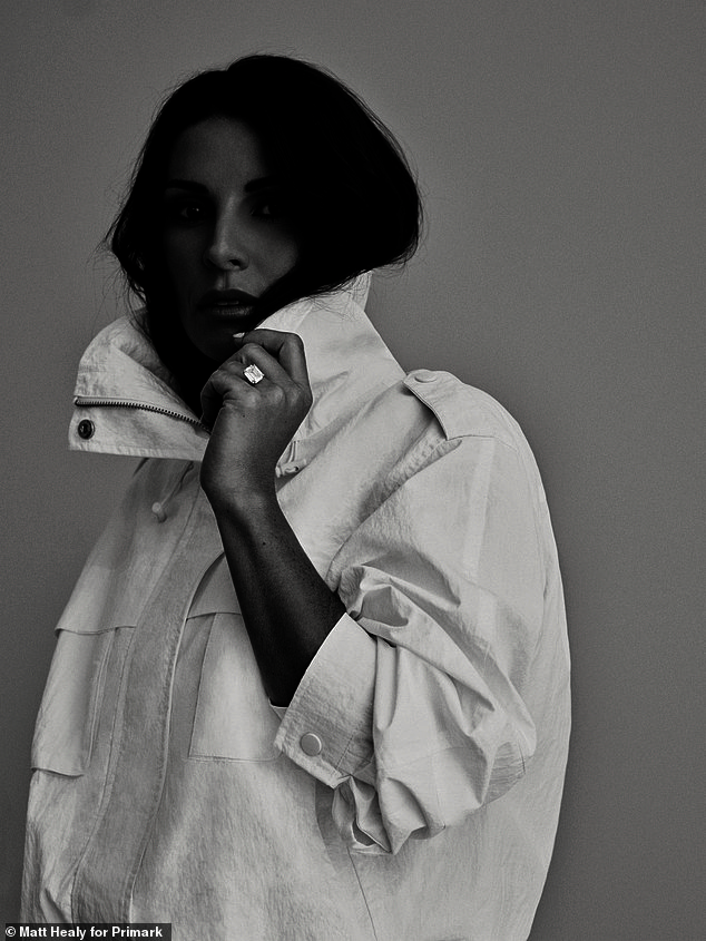 For her final look, the wife of professional football manager Wayne Rooney, 40, donned a crisp white funnel neck jacket as she posed for a striking black-and-white close-up