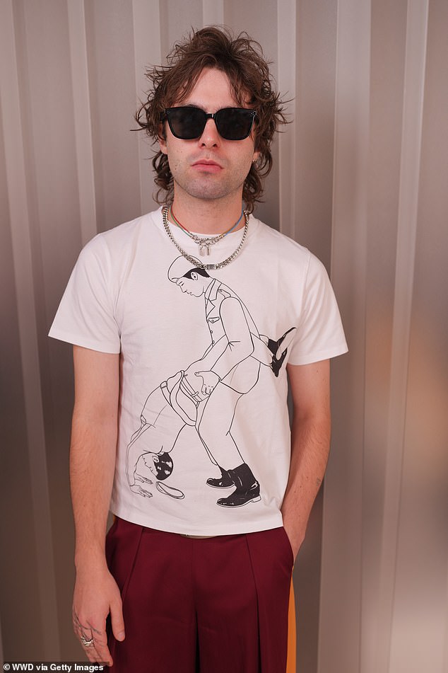 The son of Liam Gallagher shielded his eyes behind shades