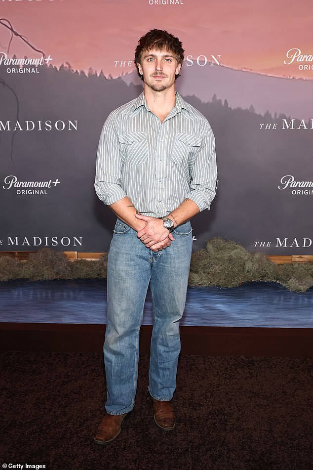 Hart Denton cut a laidback-figure for the event, wearing a grey-and-white striped shirt and blue denim jeans