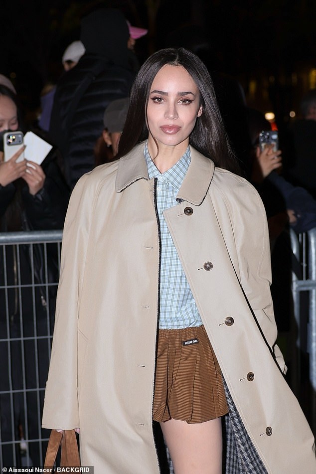 The actress opted for a trench coat and added inches to her frame in a pair of brown stilettos