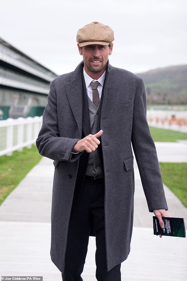 Peter Crouch went for classic race attire with a tweed baker boy cap paired with a suit layered over a grey cardigan and shirt and tie