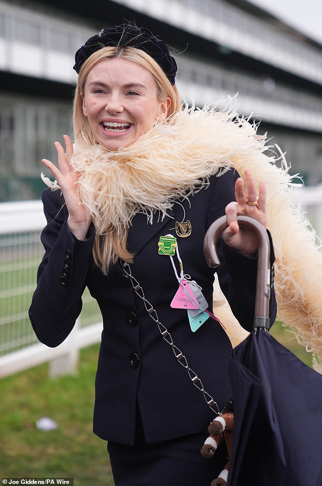 Georgia paired the look with an elegant ostrich feather scarf
