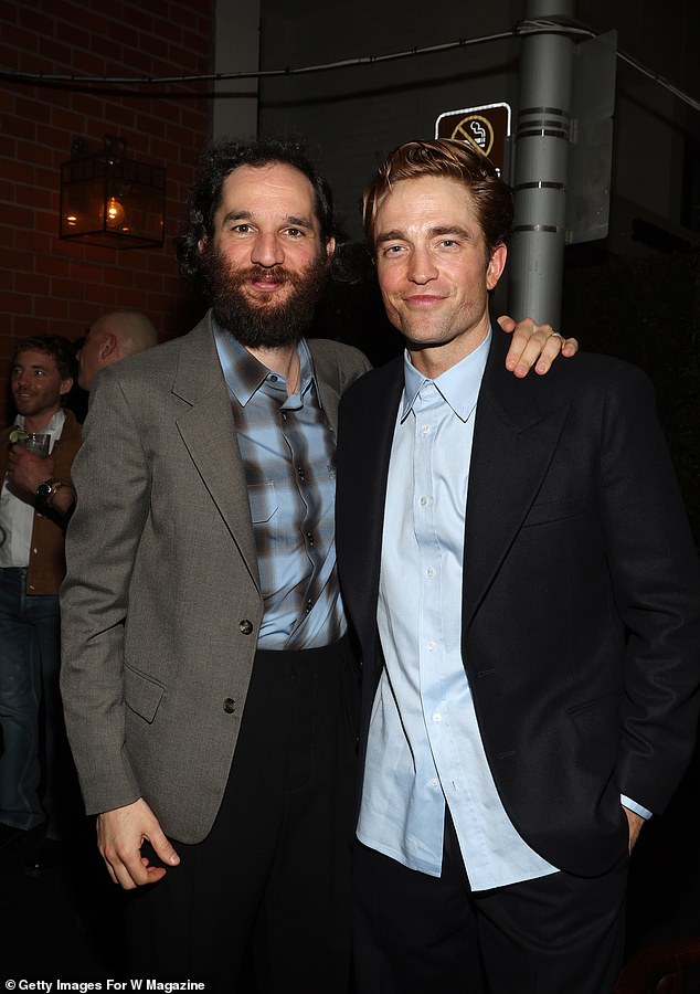 Director Josh Safdie also posed for a snap with Robert