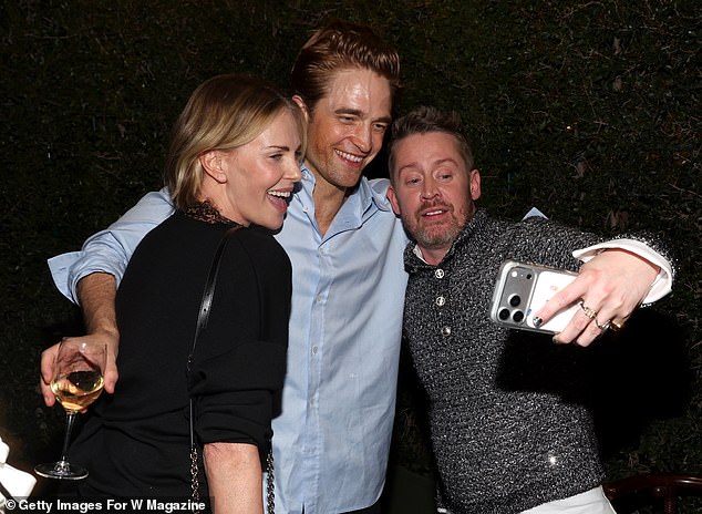 The stars were out in force for the soiree, which was held at Mr Chow in Los Angeles (pictured: Charlize Theron, Robert Pattinson and Macaulay Culkin)