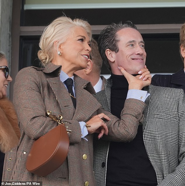 The couple put on a cosy display in the stands as Hannah took his handsome face in her hands