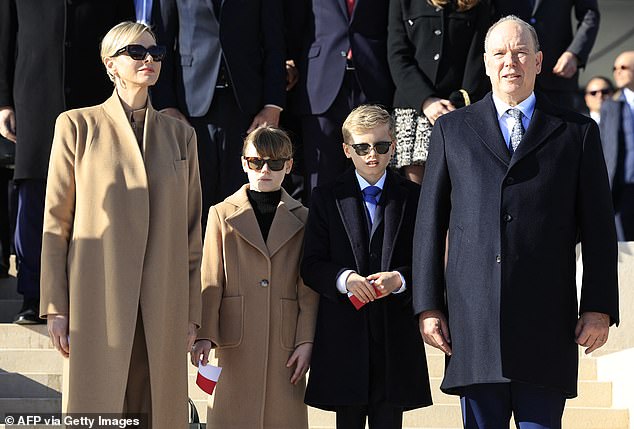 Albert and his wife pictured with their children in 2024