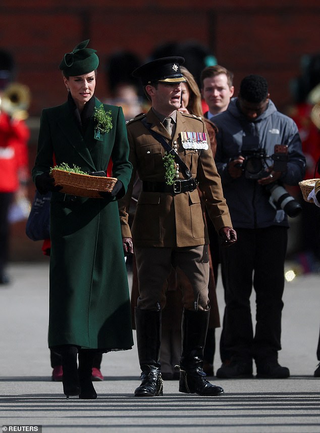 The Princess of Wales walks to present sprigs of shamrock to officers and guardsmen at the event in Aldershot
