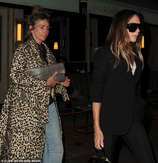 Victoria, 51, was dressed in a black suit over a white shirt and completed her look with her own brand of oversized sunglasses and killer heels