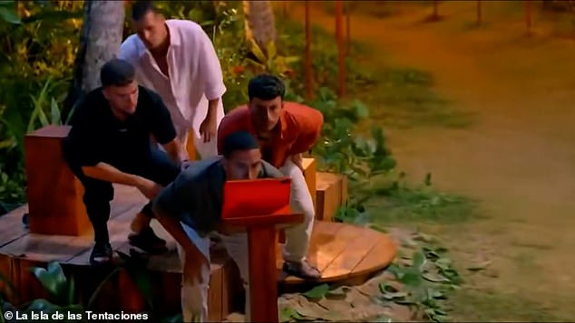 A furious Temptation Island: Spain hunk was restrained by security after watching his partner cheat on camera and charged into the villa to seek revenge