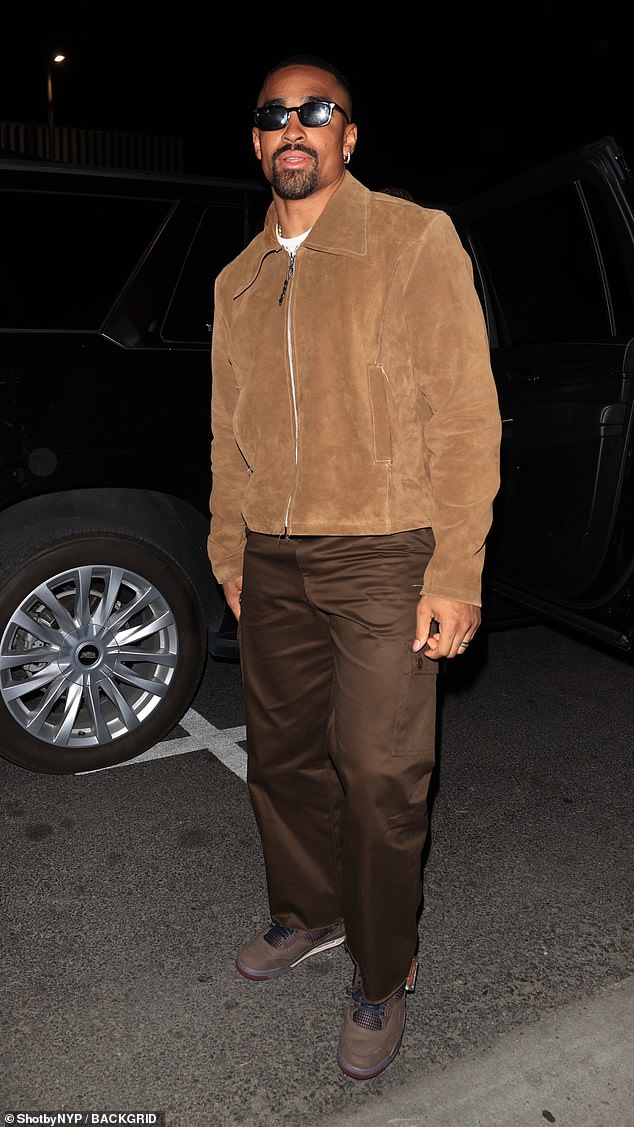 Jalen Hurts looked stylish in a suede jacket and brown trousers