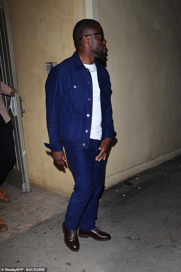 Kevin donned a pair of black sunglasses as he departed for the night