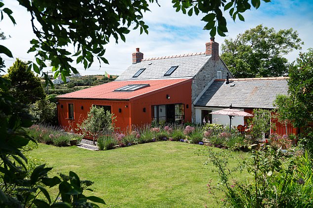 Bryn Teifi, a stone cottage with two bedrooms, exposed beams, a fireplace and pretty garden