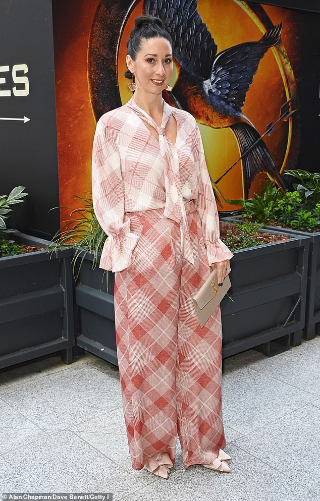 Rachel cut a chic figure in a plaid co-ord and toted her essentials in a YSL clutch