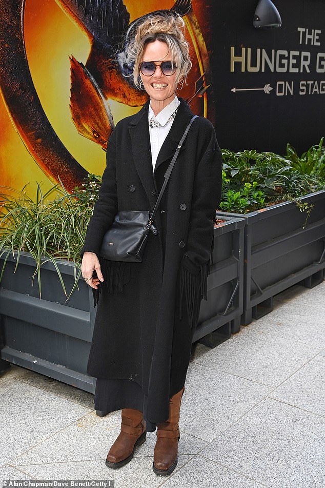 EastEnders' Charlie Brooks wrapped up in a long wool coat