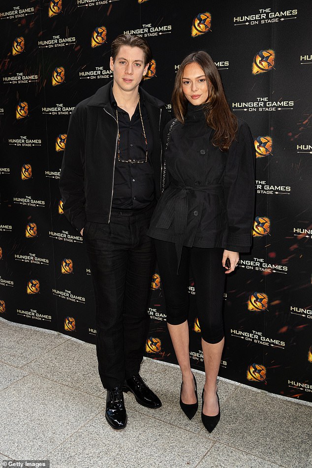 Sam, 29, co-ordinated with the stunning Alice, 24, in all black as he layered a sported jacket over a shirt and smart trousers