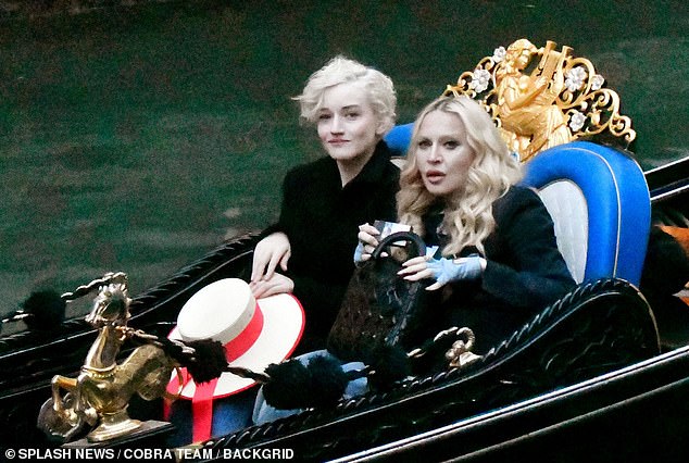 The Hung Up hitmaker wore fingerless blue gloves and clutched a black designer handbag