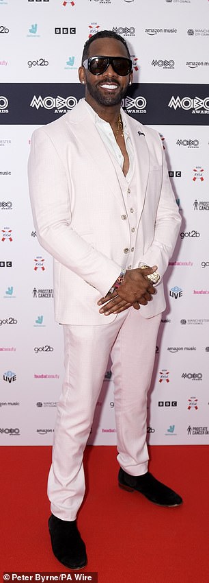 While Richard, 53, looked suave in a crisp white suit and black suede shoes