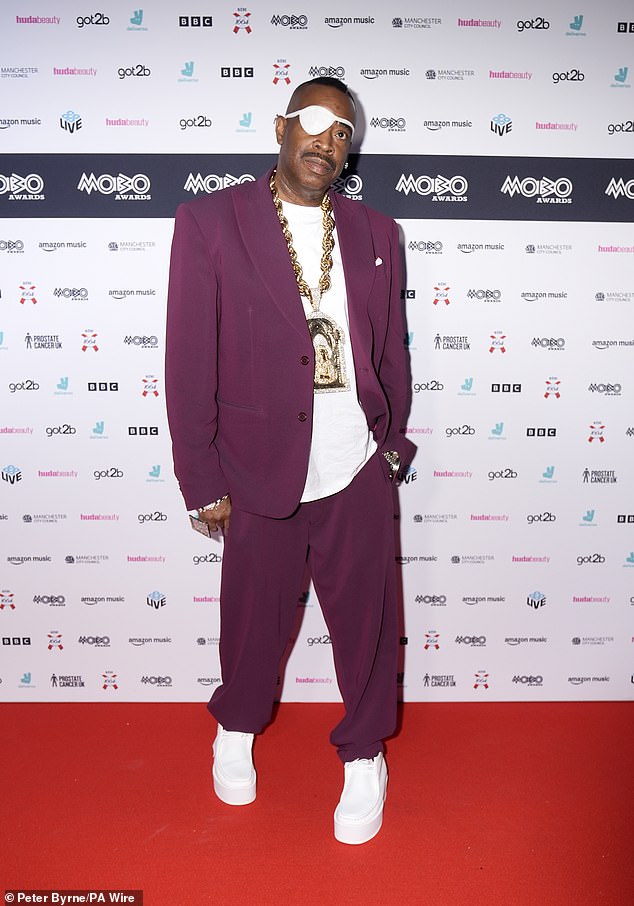 While Slick Rick, real name Ricky Martin Lloyd Walters, 61, looked sharp in a plum blazer and coordinating trousers