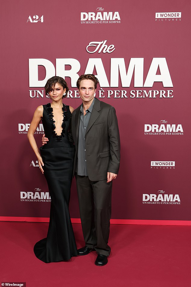 The actress, 29, looked incredible as she ditched her bra in a daring low-cut black gown, while joining her co-star Robert Pattinson, 39