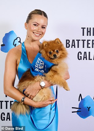 Tasha Ghouri with Battersea rescue dog Nemo on the blue carpet