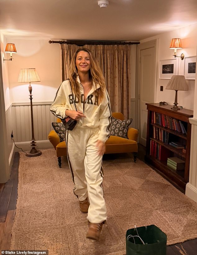 In another look Blake opted for a white tracksuit featuring brown striped lining and a pair of chunky beige boots