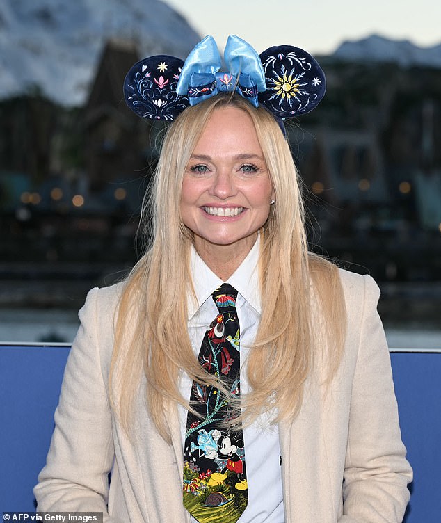 Posing for snaps at the press event, Emma got into the Disney spirit as she wore a pair of embroidered navy Minnie Mouse ears and a Mickey Mouse patterned tie